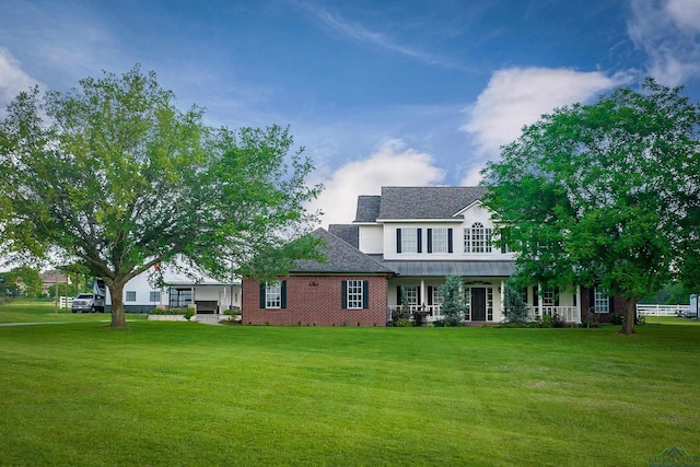 4300 Willow Bnd, Longview, TX 75602 - view of front of house with a front yard, covered porch, and roof with shingles