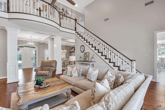 4300 Willow Bnd, Longview, TX 75602 - living room featuring a chandelier, ornate columns, a towering ceiling, hardwood / wood-style floors, and crown molding