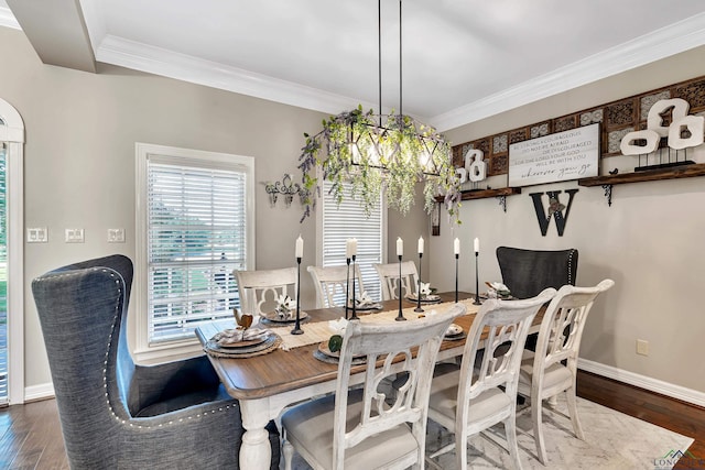 4300 Willow Bnd, Longview, TX 75602 - dining room with crown molding, wood finished floors, a chandelier, and baseboards