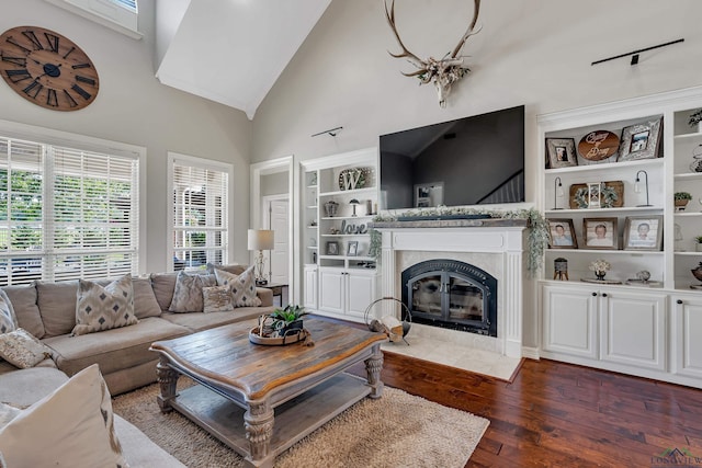 4300 Willow Bnd, Longview, TX 75602 - living room with dark wood-type flooring, a fireplace with flush hearth, high vaulted ceiling, and built in features