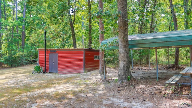 view of outbuilding featuring a carport