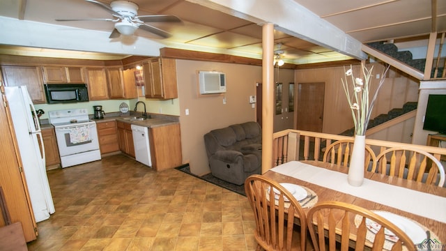 kitchen with white appliances, ceiling fan, sink, and an AC wall unit