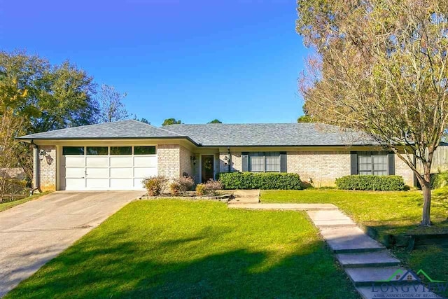 ranch-style home featuring a garage and a front lawn