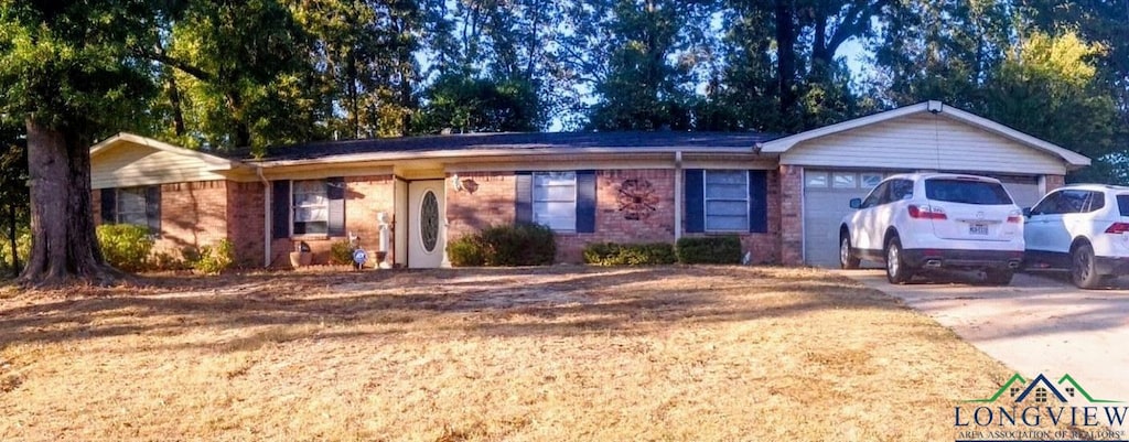 ranch-style house featuring a garage