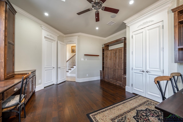 office area featuring ceiling fan, dark hardwood / wood-style flooring, and crown molding