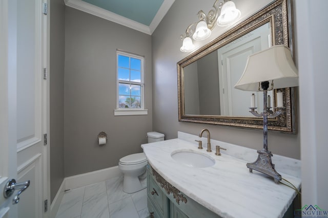 bathroom featuring vanity, toilet, and ornamental molding