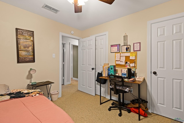 bedroom with light carpet and ceiling fan