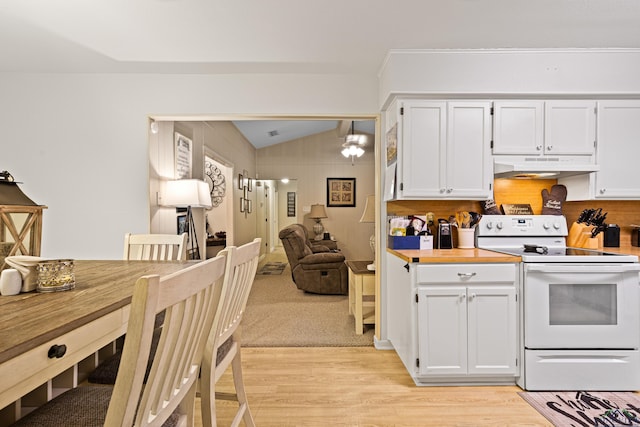 kitchen featuring lofted ceiling, white cabinetry, hanging light fixtures, white range with electric stovetop, and light wood-type flooring