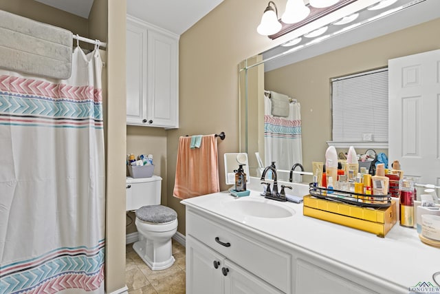 bathroom with tile patterned floors, vanity, toilet, and curtained shower