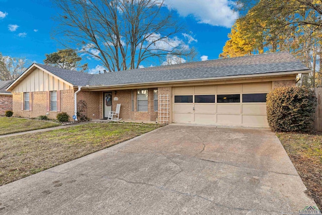 ranch-style home featuring a garage and a front yard