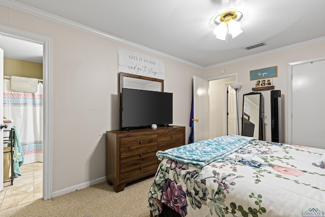 carpeted bedroom featuring crown molding and connected bathroom