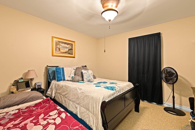 bedroom featuring ceiling fan and carpet