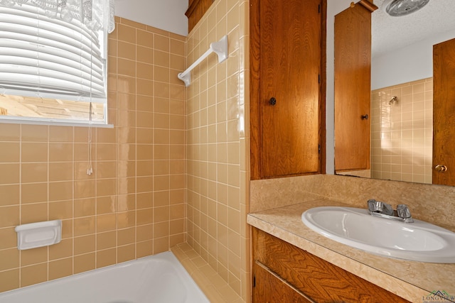 full bath featuring washtub / shower combination and vanity