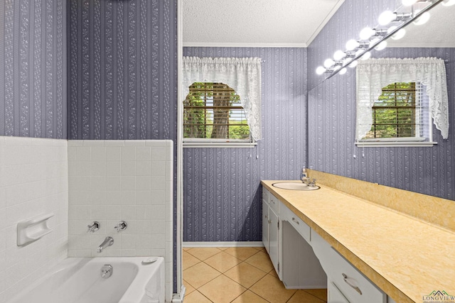 full bathroom featuring tile patterned floors, a textured ceiling, wallpapered walls, a tub, and ornamental molding