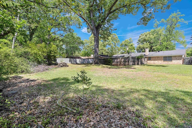 view of yard featuring a fenced backyard