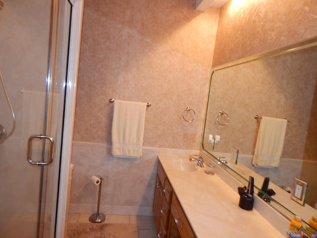 3073 E Lake Dr, Gladewater, TX 75647 - full bathroom with vanity, a stall shower, and tile patterned flooring