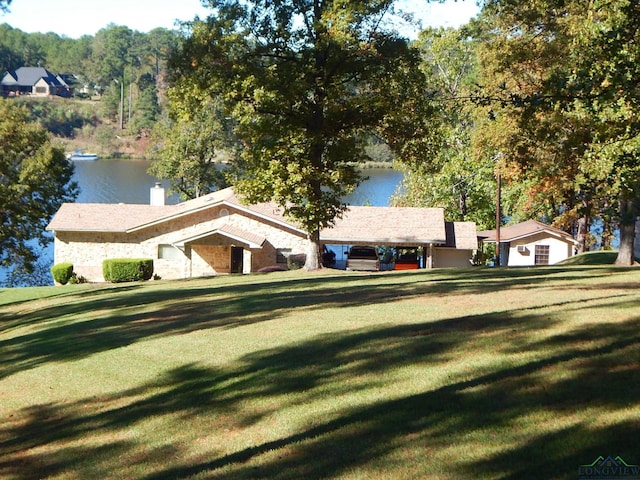 3073 E Lake Dr, Gladewater, TX 75647 - single story home with a front yard, a water view, and a chimney