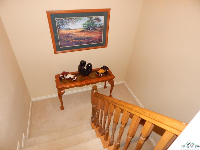 3073 E Lake Dr, Gladewater, TX 75647 - staircase featuring carpet flooring and baseboards