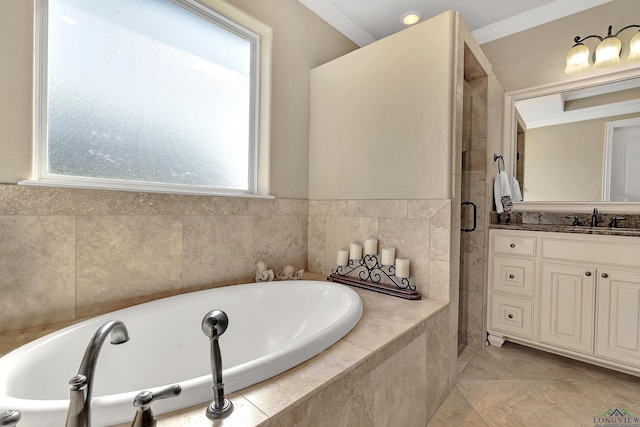 full bath featuring a garden tub, tile patterned floors, crown molding, and vanity