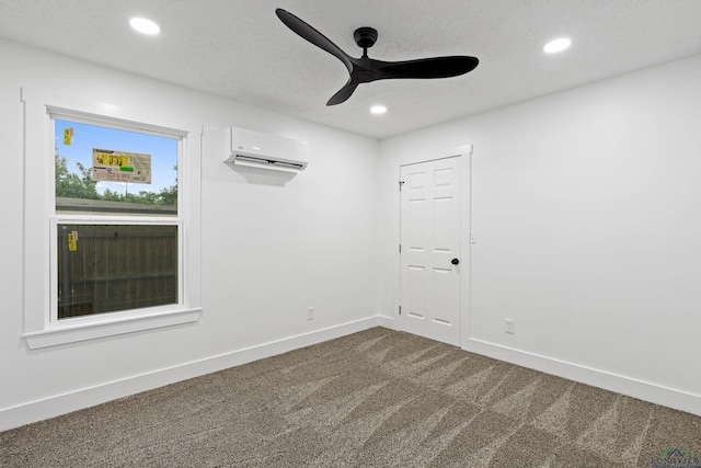 empty room with carpet, an AC wall unit, and ceiling fan