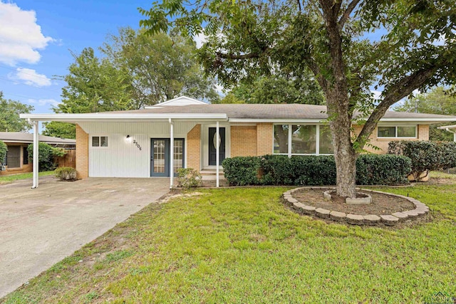 ranch-style home with a carport and a front yard