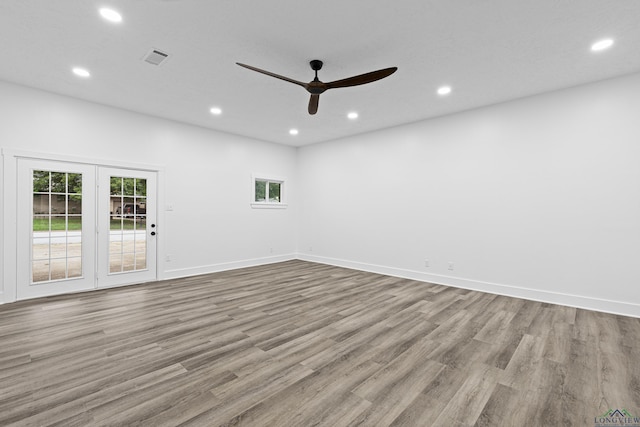 unfurnished room with ceiling fan and light hardwood / wood-style flooring