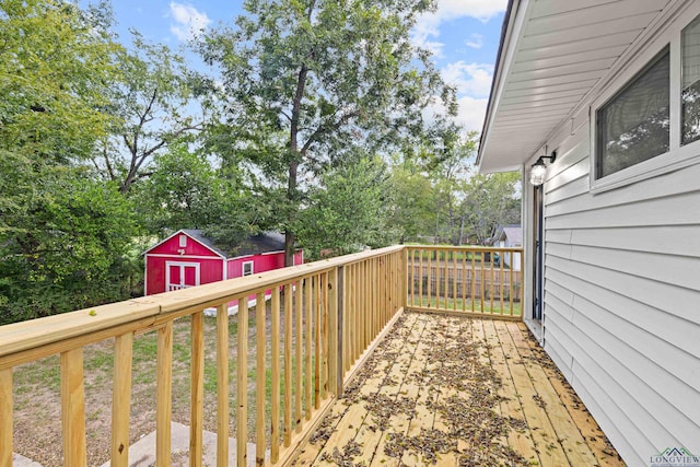 wooden deck featuring a shed