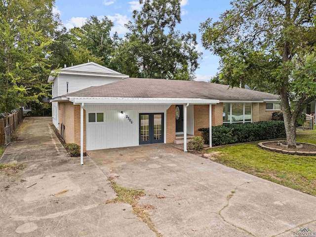 view of front facade with french doors and a front yard