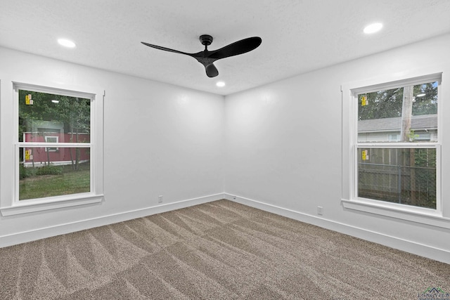 unfurnished room featuring carpet and ceiling fan