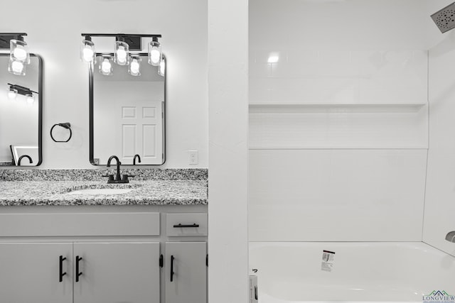 bathroom featuring vanity and bathtub / shower combination