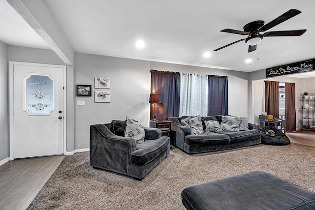 living room featuring a ceiling fan, baseboards, wood finished floors, and recessed lighting