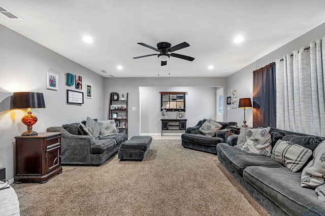 living area with ceiling fan, recessed lighting, visible vents, and light colored carpet