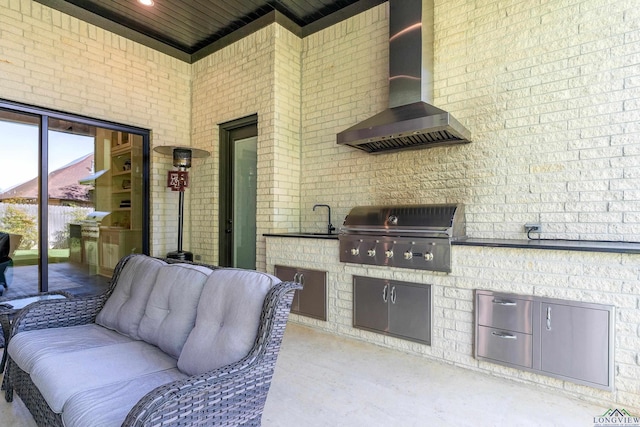 view of patio / terrace featuring an outdoor living space, a sink, and area for grilling