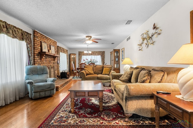 6940 Fm 778, Hawkins, TX 75765 - living area featuring wood finished floors, a textured ceiling, and ceiling fan