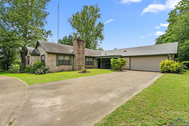 6940 Fm 778, Hawkins, TX 75765 - view of front of property with brick siding, concrete driveway, a chimney, a garage, and a front lawn