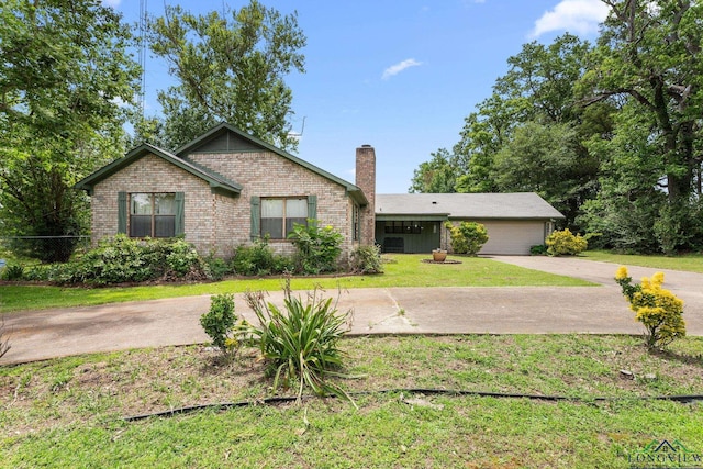 6940 Fm 778, Hawkins, TX 75765 - ranch-style house with a chimney, driveway, brick siding, and a garage