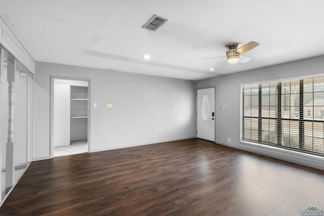 empty room with wood finished floors, baseboards, visible vents, recessed lighting, and ceiling fan