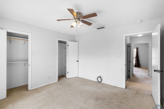 unfurnished bedroom with visible vents, baseboards, ceiling fan, carpet flooring, and a closet