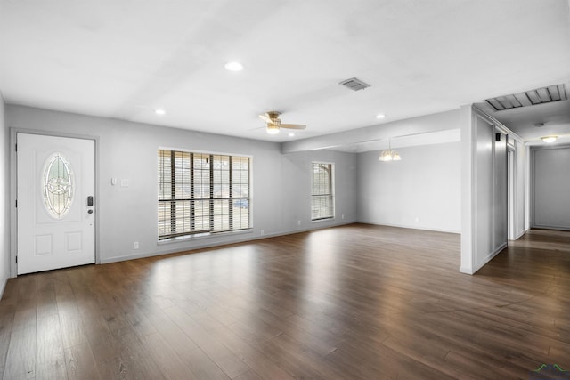 foyer featuring dark wood-type flooring, recessed lighting, and visible vents