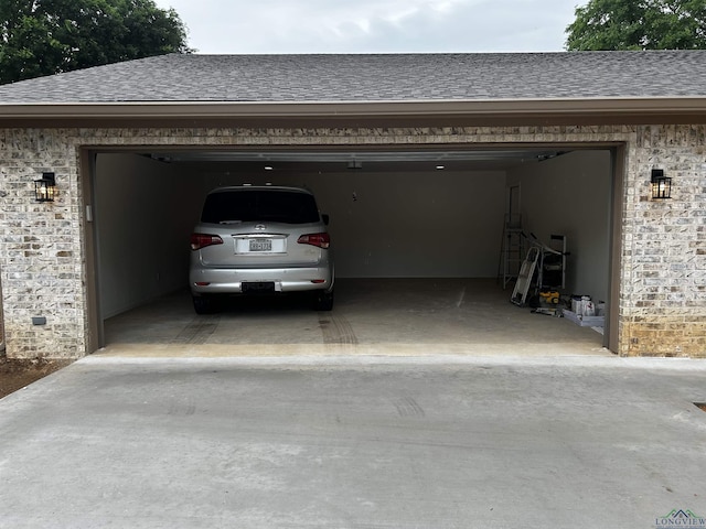 115 Alta St, Longview, TX 75604 - view of parking / parking lot featuring driveway and a garage