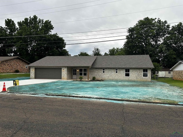 115 Alta St, Longview, TX 75604 - single story home with driveway, an attached garage, and stone siding