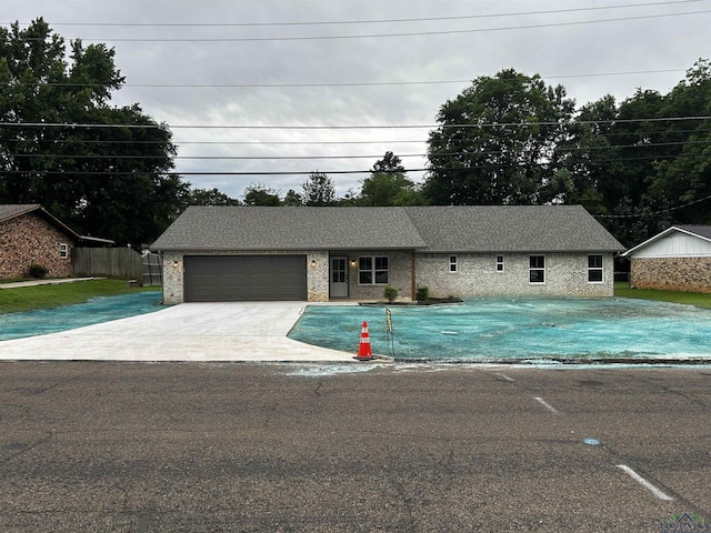 115 Alta St, Longview, TX 75604 - ranch-style home with an attached garage and driveway