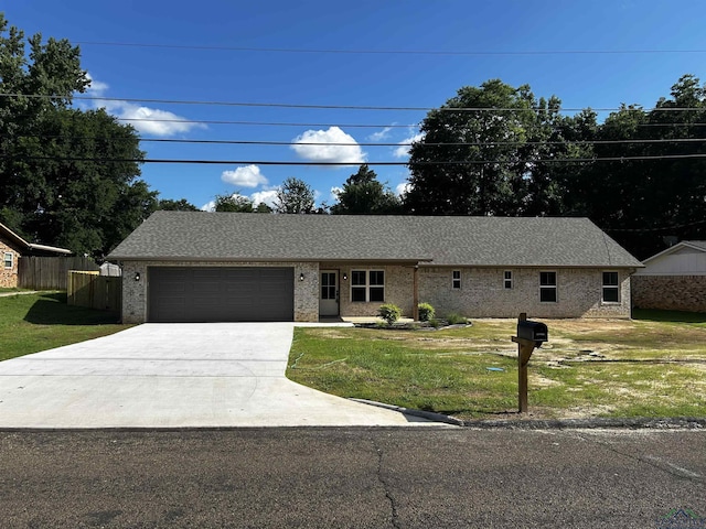 115 Alta St, Longview, TX 75604 - ranch-style house with a garage, driveway, and brick siding
