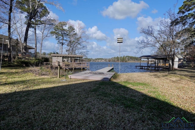 dock area featuring a yard and a water view