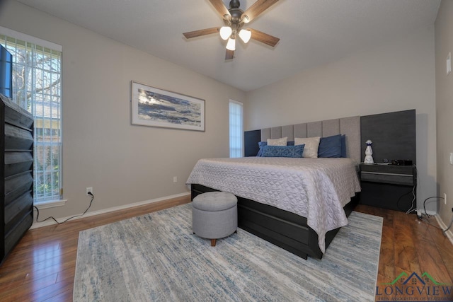 bedroom featuring dark hardwood / wood-style flooring and ceiling fan