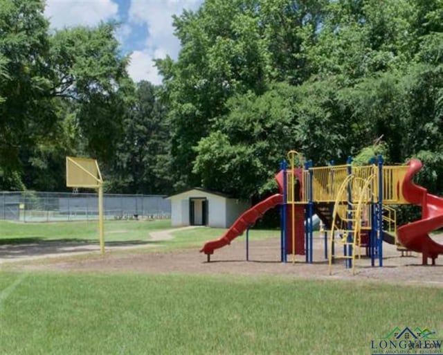 view of play area featuring a lawn