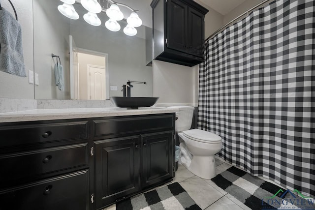 bathroom with vanity, tile patterned floors, and toilet