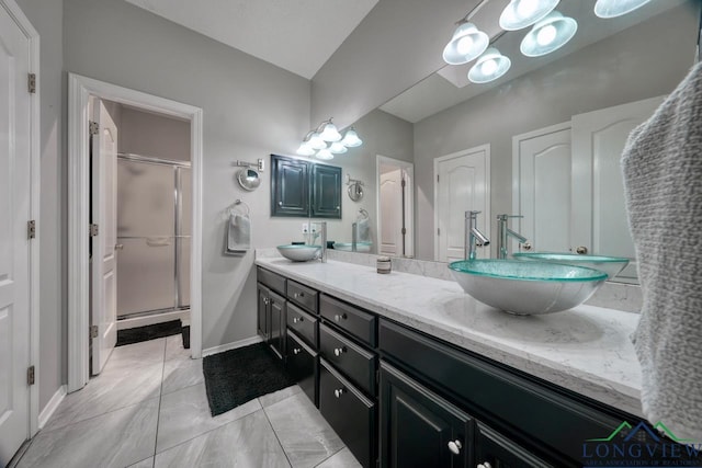 bathroom with vanity and an enclosed shower