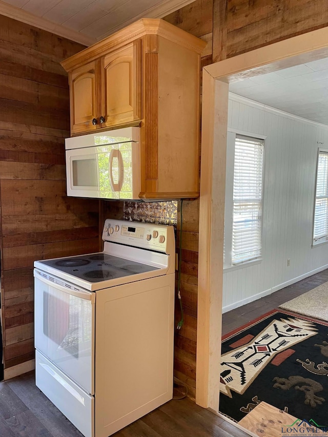 kitchen with white appliances, dark wood-type flooring, and ornamental molding