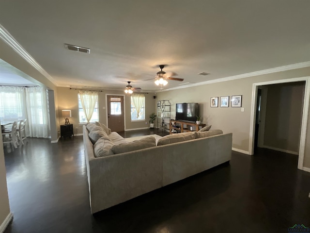 living room featuring crown molding and ceiling fan